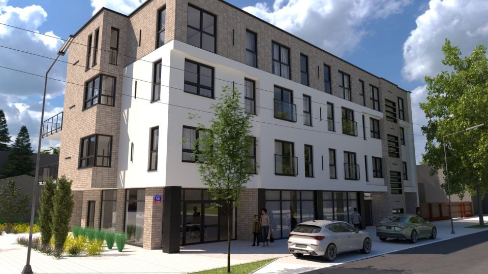Wizualizacja nowoczesnego, czterokondygnacyjnego budynku mieszkalnego z dużymi oknami i balkonami. Przed apartamentowcem rosną drzewa i krzewy, na chodniku stoją zaparkowane samochody, a obok wejścia widoczne są osoby. Budynek znajduje się przy ulicy z latarniami, na tle błękitnego nieba z chmurami.